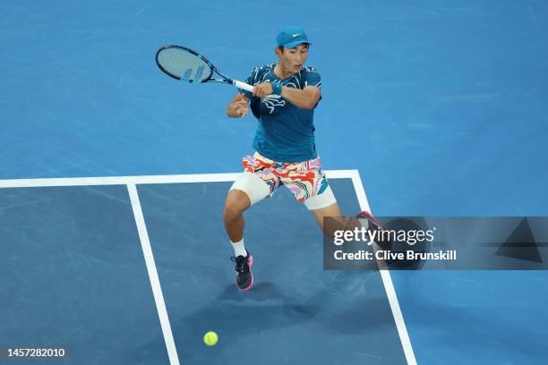 Juncheng Shang of China plays a forehand in their round two singles match against Frances Tiafoe of the United States during day three of the 2023...