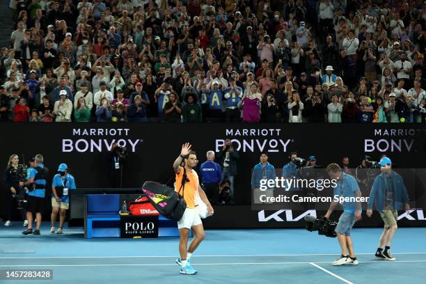 Rafael Nadal of Spain acknowledges the crowd after losing their round two singles match against Mackenzie McDonald of the United States during day...