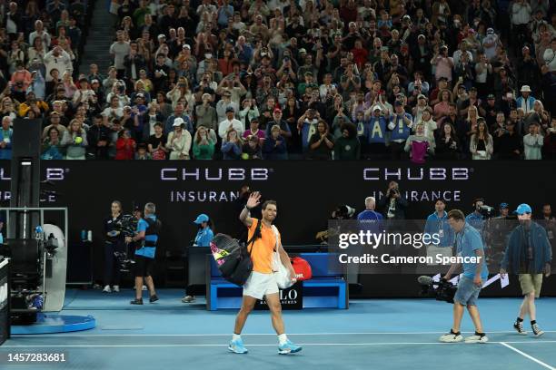 Rafael Nadal of Spain acknowledges the crowd after losing their round two singles match against Mackenzie McDonald of the United States during day...