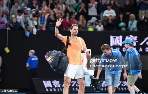 Rafael Nadal of Spain waves goodbye to the crowd on Rod Laver Arena after losing against Mackenzie McDonald of the United States in his round two...