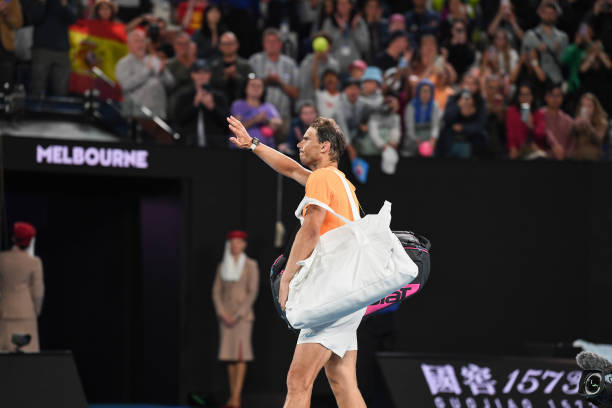 Rafael Nadal of Spain waves goodbye to the crowd on Rod Laver Arena after losing against Mackenzie McDonald of the United States in his round two...