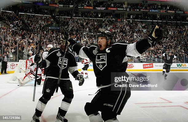 Dustin Brown of the Los Angeles Kings and Justin Williams celebrate after teammate Anze Kopitar scored a goal in the second period of Game Three of...