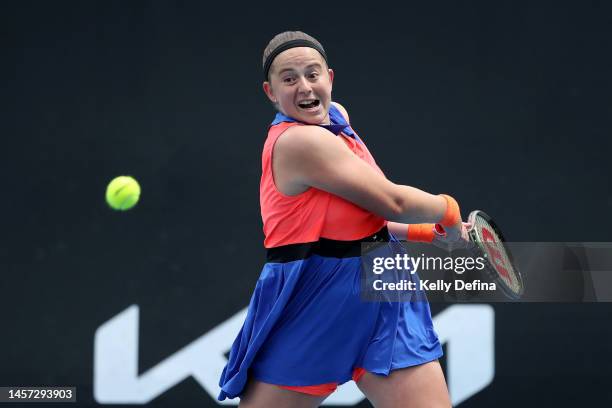 Jelena Ostapenko of Latvia plays a backhand in their round two singles match against Anna Bondar of Hungary during day three of the 2023 Australian...