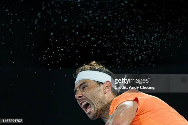Rafael Nadal of Spain serves in the round two singles match against Mackenzie McDonald of the United States during day three of the 2023 Australian...