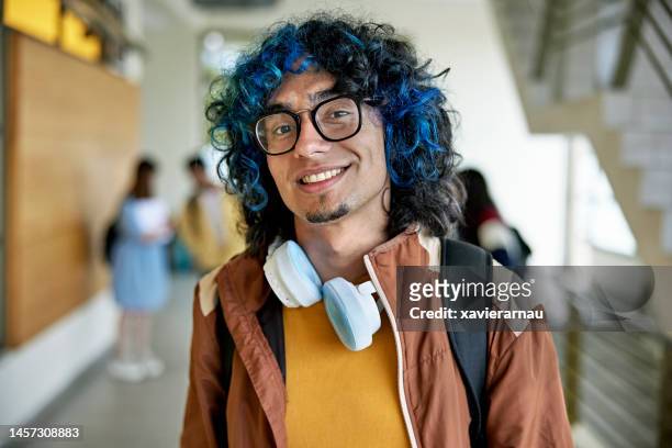 portrait of confident male college student - goatee stockfoto's en -beelden