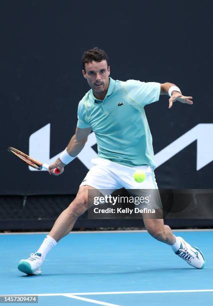 Roberto Bautista Agut of Spain plays a forehand in their round one singles match against Joao Sousa of Portugal during day three of the 2023...