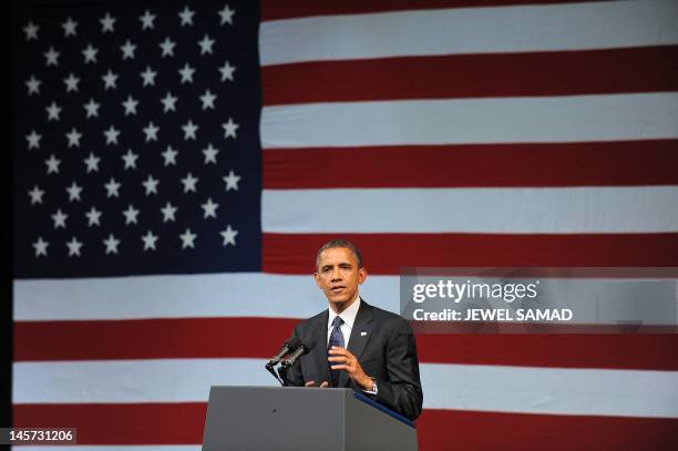 President Barack Obama speaks during a campaign event at the New Amsterdam Theatre in New York on June 4, 2012. Obama is perched on a economic and...