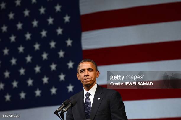 President Barack Obama speaks during a campaign event at the New Amsterdam Theatre in New York on June 4, 2012. Obama is perched on a economic and...