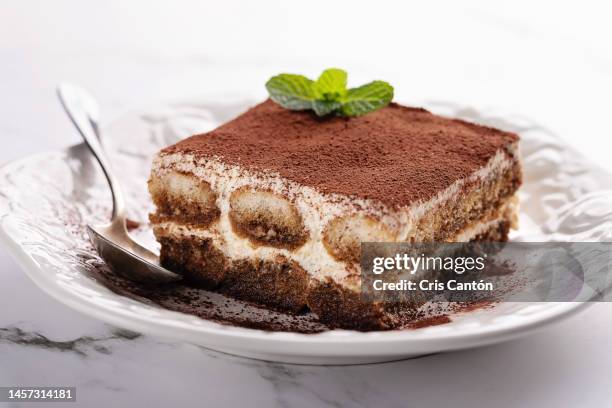 tiramisu on white background - tiramisù foto e immagini stock