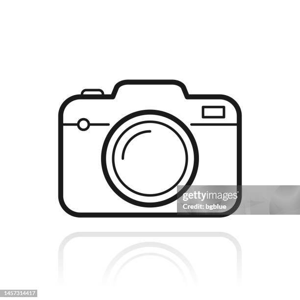 camera. icon with reflection on white background - camera flash white background stock illustrations