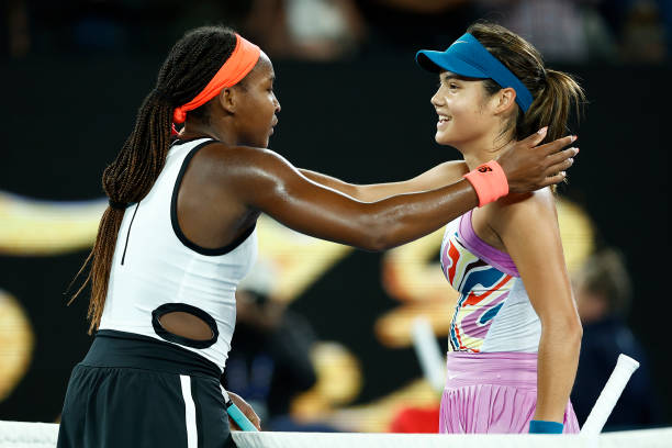 Coco Gauff of the United States embraces Emma Raducanu of Great Britain after winning their round two singles match during day three of the 2023...