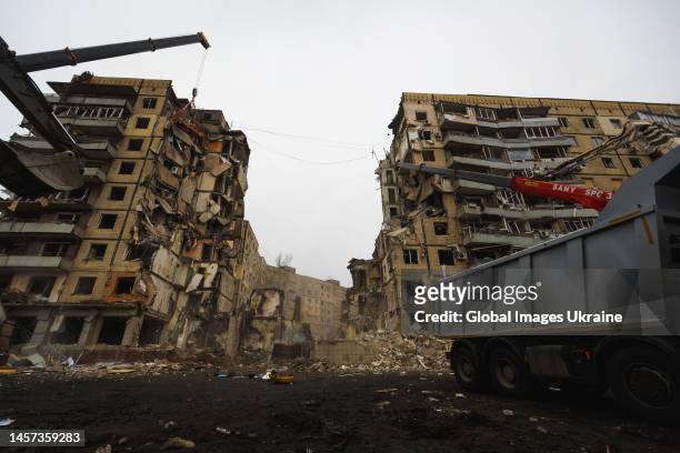 High-rise residential building lies partially destroyed after a missile strike on January 16, 2023 in Dnipro, Ukraine. On January 14, Russia launched...
