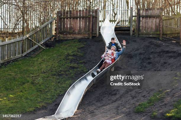 enjoying the park with our dad - adoption family stock pictures, royalty-free photos & images