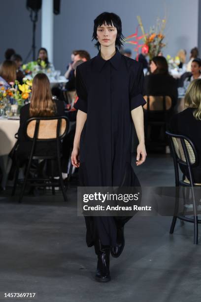 Model walks the runway at the Fassbender x NEWEST runway show during the Berlin Fashion Week AW23 at Kant-Garagen on January 18, 2023 in Berlin,...