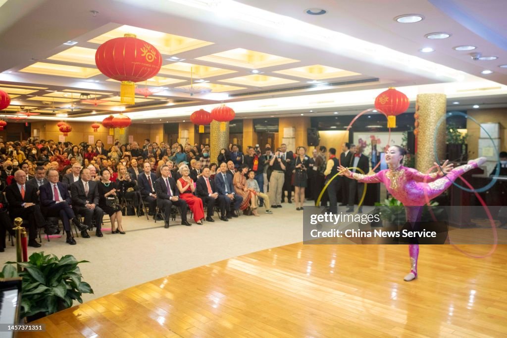 Attendees watch a acrobatics during the 2023 Chinese New Year... News ...