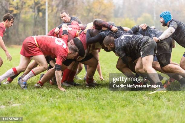 rugby teams performing scrum - scrum stock pictures, royalty-free photos & images