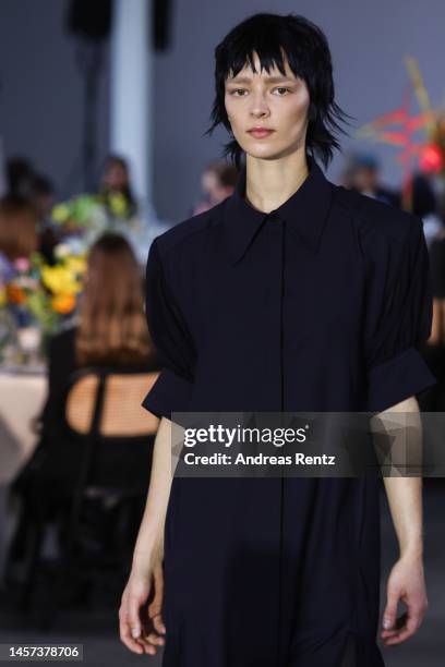 Model walks the runway at the Fassbender x NEWEST runway show during the Berlin Fashion Week AW23 at Kant-Garagen on January 18, 2023 in Berlin,...