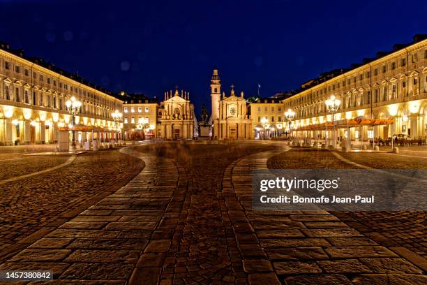 in the heart of turin piazza san carlo by night - turin church stock pictures, royalty-free photos & images