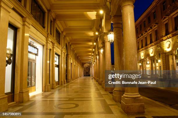 via roma through turin at dusk - via roma stock pictures, royalty-free photos & images