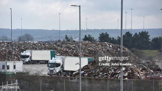 Tonnes of waste wood which is to be processed into biomass fuel is stored at a Esken Renewables site on January 16, 2023 in Tilbury, England .