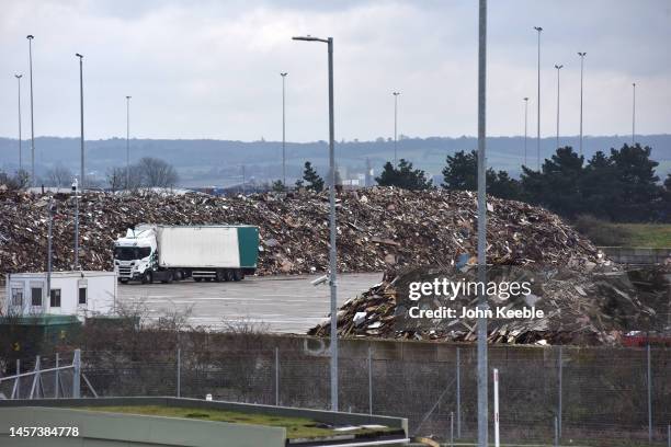 Tonnes of waste wood which is to be processed into biomass fuel is stored at a Esken Renewables site on January 16, 2023 in Tilbury, England .