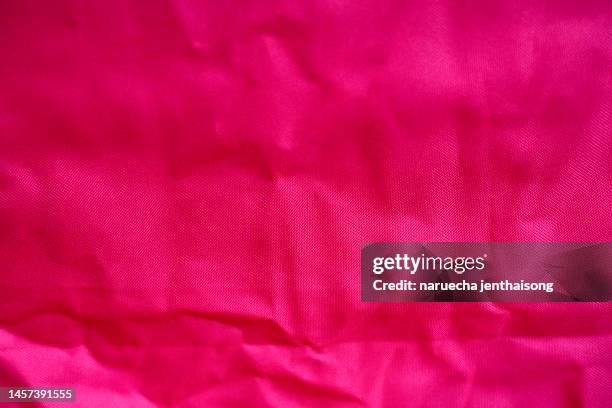 pink fabric cloth polyester texture and textile background. - pink jersey stock-fotos und bilder