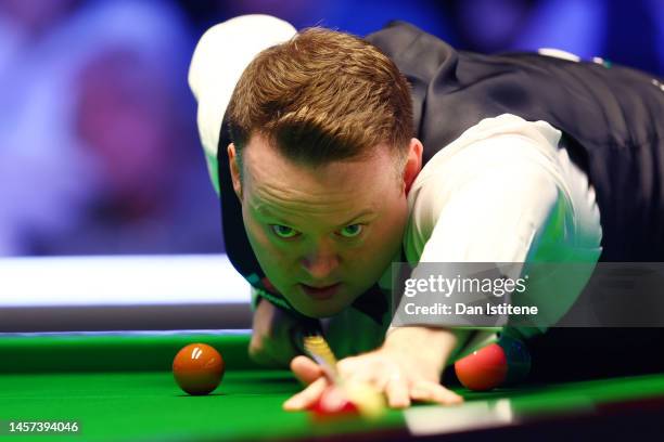 Shaun Murphy of England plays a shot during his first round match against Ali Carter of England during the 2023 World Grand Prix at Centaur Arena on...