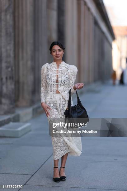 Alyssa Cordes seen wearing a total Dior look with a white transparent long dress, black heels and a black bag during the Berlin Fashion Week AW23 on...