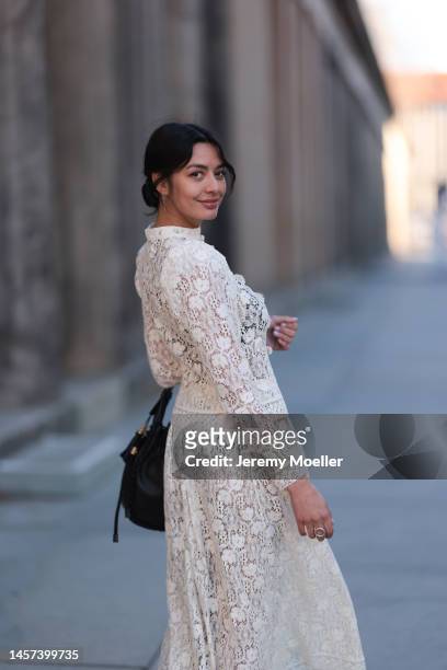 Alyssa Cordes seen wearing a total Dior look with a white transparent long dress, black heels and a black bag during the Berlin Fashion Week AW23 on...