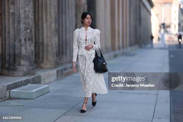 Alyssa Cordes seen wearing a total Dior look with a white transparent long dress, black heels and a black bag during the Berlin Fashion Week AW23 on...