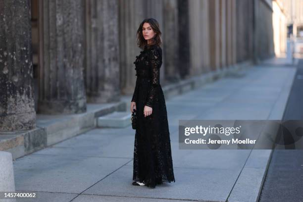 Giannina Haupt seen wearing a total Dior look with a black transparent dress, white and black heels and a black leather bag during the Berlin Fashion...