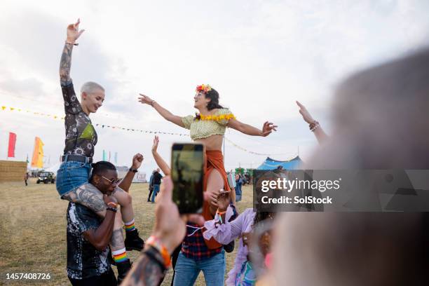 Shoulder Rides Concert 687 Riding On Shoulders Concert Stock Photos, High-Res Pictures, and ...