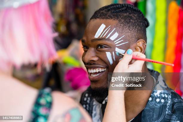 festival face paint - pintura de cara fotografías e imágenes de stock