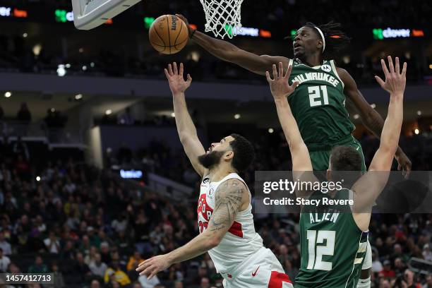 Jrue Holiday of the Milwaukee Bucks blocks a shot by Fred VanVleet of the Toronto Raptors during a game at Fiserv Forum on January 17, 2023 in...