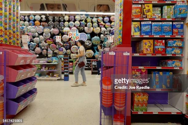 People shop in a Party City store on January 18, 2023 in Miami, Florida. Party City Holdco Inc. Filed for Chapter 11 bankruptcy protection in a bid...