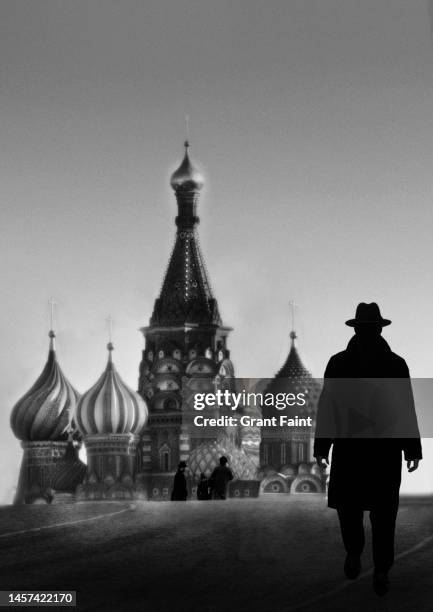 man walking in red square. - surveillance society stock pictures, royalty-free photos & images