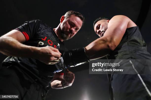 Andy Lee ties Joseph Parker's gloves up during the Chris Eubank Jr v Liam Smith Media workout at The Trafford Centre on January 18, 2023 in...