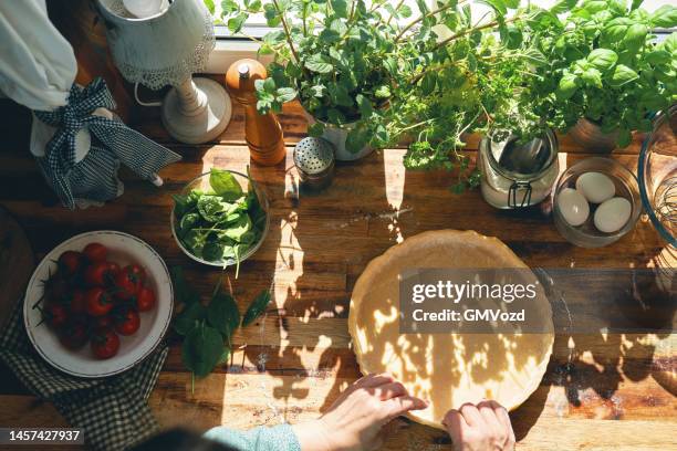 preparing quiche lorraine with tomatoes - basil stock pictures, royalty-free photos & images