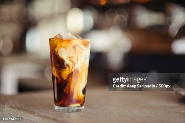 close-up of iced coffee on table,denver,colorado,united states,usa - milchkaffee stock-fotos und bilder