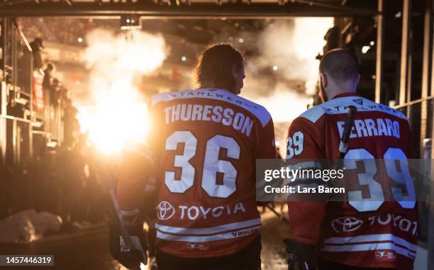 Andreas Thuresson of Haie and Landon Ferraro of Haie are seen on their way to the ice during the Penny DEL match between Kölner Haie and Schwenninger...