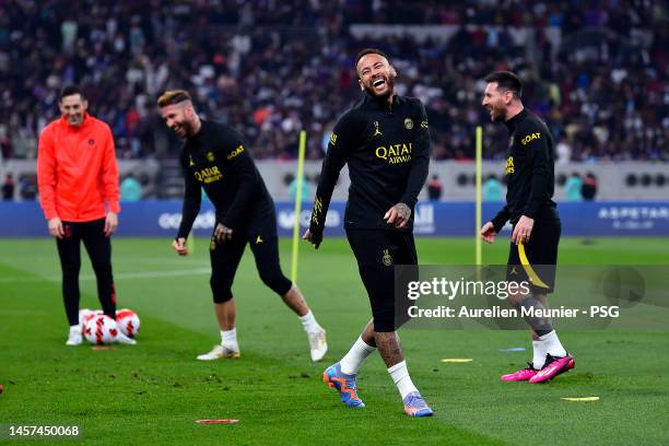 Sergio Ramos, Neymar Jr and Leo Messi react during a Paris Saint-Germain training session during the Paris Saint-Germain Qatar Winter Tour 2023 at...