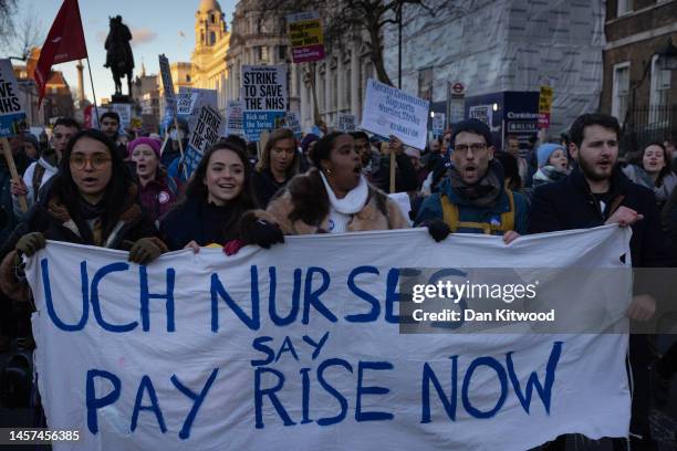 Nursing staff and supporters march down Whitehall to Downing Street during a day of strikes, on January 18, 2023 in London, United Kingdom. Members...