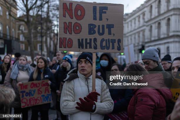 Nursing staff and supporters march down Whitehall to Downing Street during a day of strikes, on January 18, 2023 in London, United Kingdom. Members...