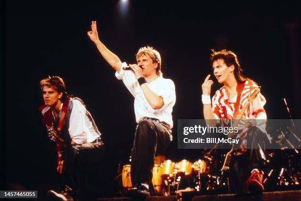 John Taylor, Simon LeBon and Andy Taylor of the band Duran Duran in concert at The Spectrum in Philadelphia, Pennsylvania