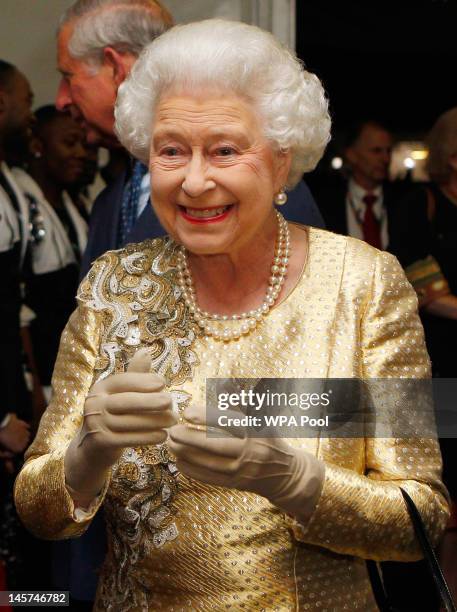 Queen Elizabeth II meets guests backstage after the Diamond Jubilee, Buckingham Palace Concert on June 04, 2012 in London, England. For only the...