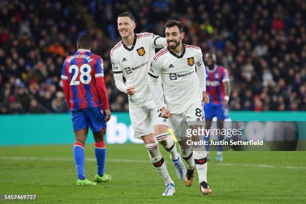 Bruno Fernandes of Manchester United celebrates after scoring the team's first goal with teammate Wout Weghorst during the Premier League match...