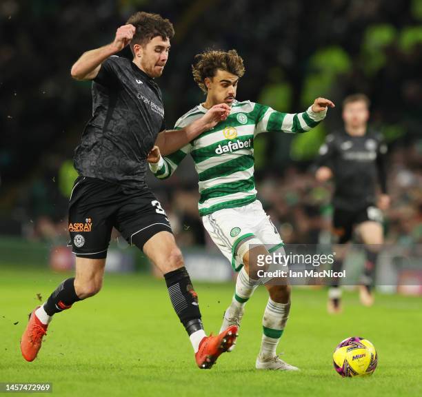 Jota of Celtic is challenged by Declan Gallagher of St Mirren during the Cinch Scottish Premiership match between Celtic FC and St. Mirren FC at...
