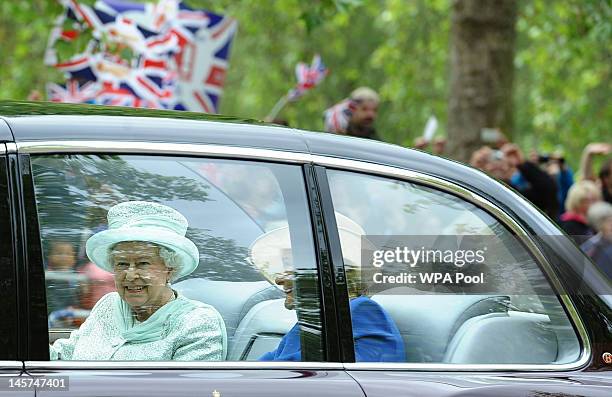Queen Elizabeth II and Diana Marion, The Lady Farnham, make their way down the Mall to St Paul's for a service of thanksgiving on June 5, 2012 in...