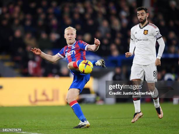 Will Hughes of Crystal Palace has a shot on goal whilst under pressure from Bruno Fernandes of Manchester United during the Premier League match...