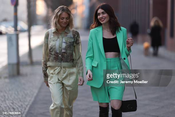 Ira Meindl and Olga Löffler seen wearing total Marc Cain looks during the Berlin Fashion Week AW23 on January 17, 2023 in Berlin, Germany.